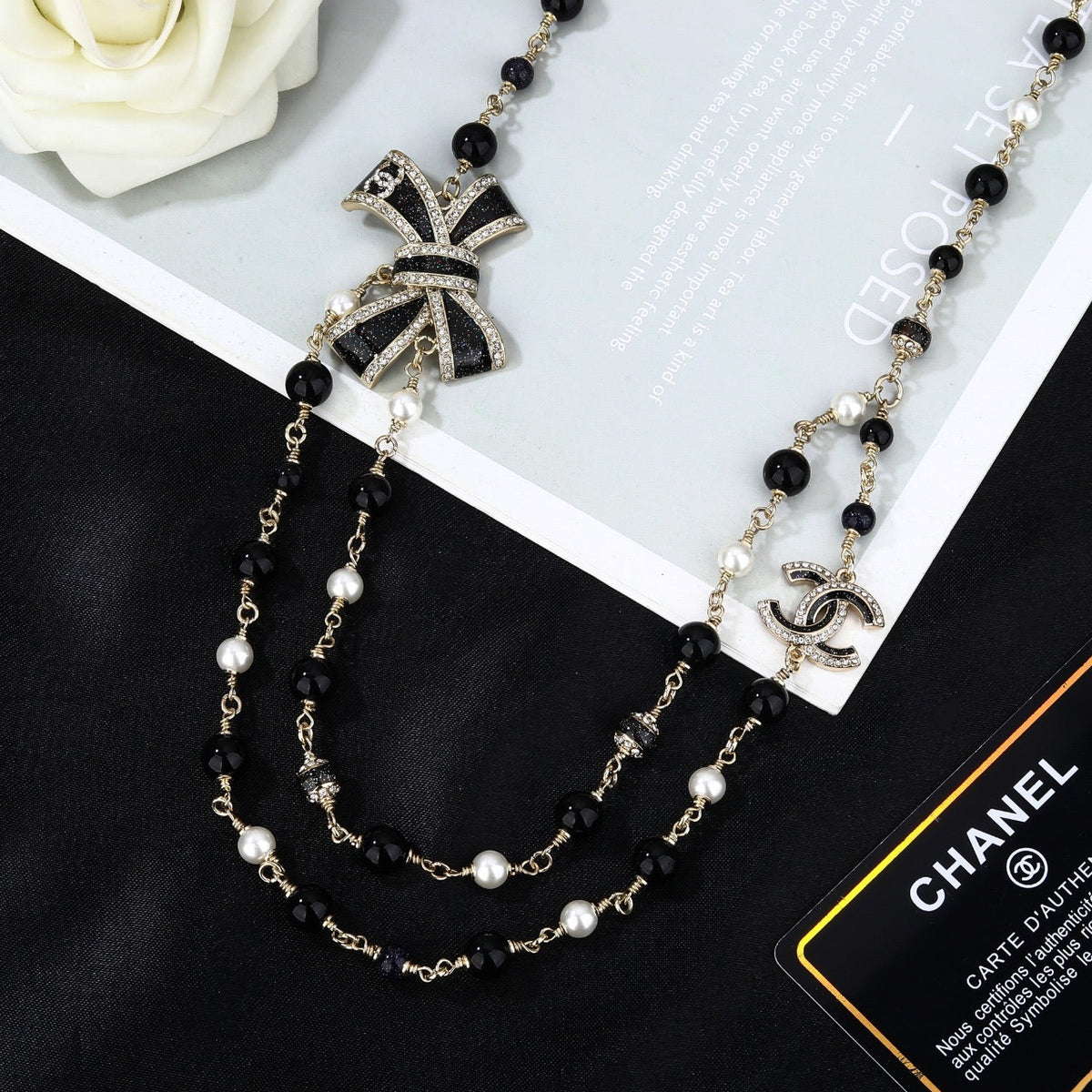 CHANEL 25S CHAIN BELT IN BLACK AND WHITE PEARL 614285
